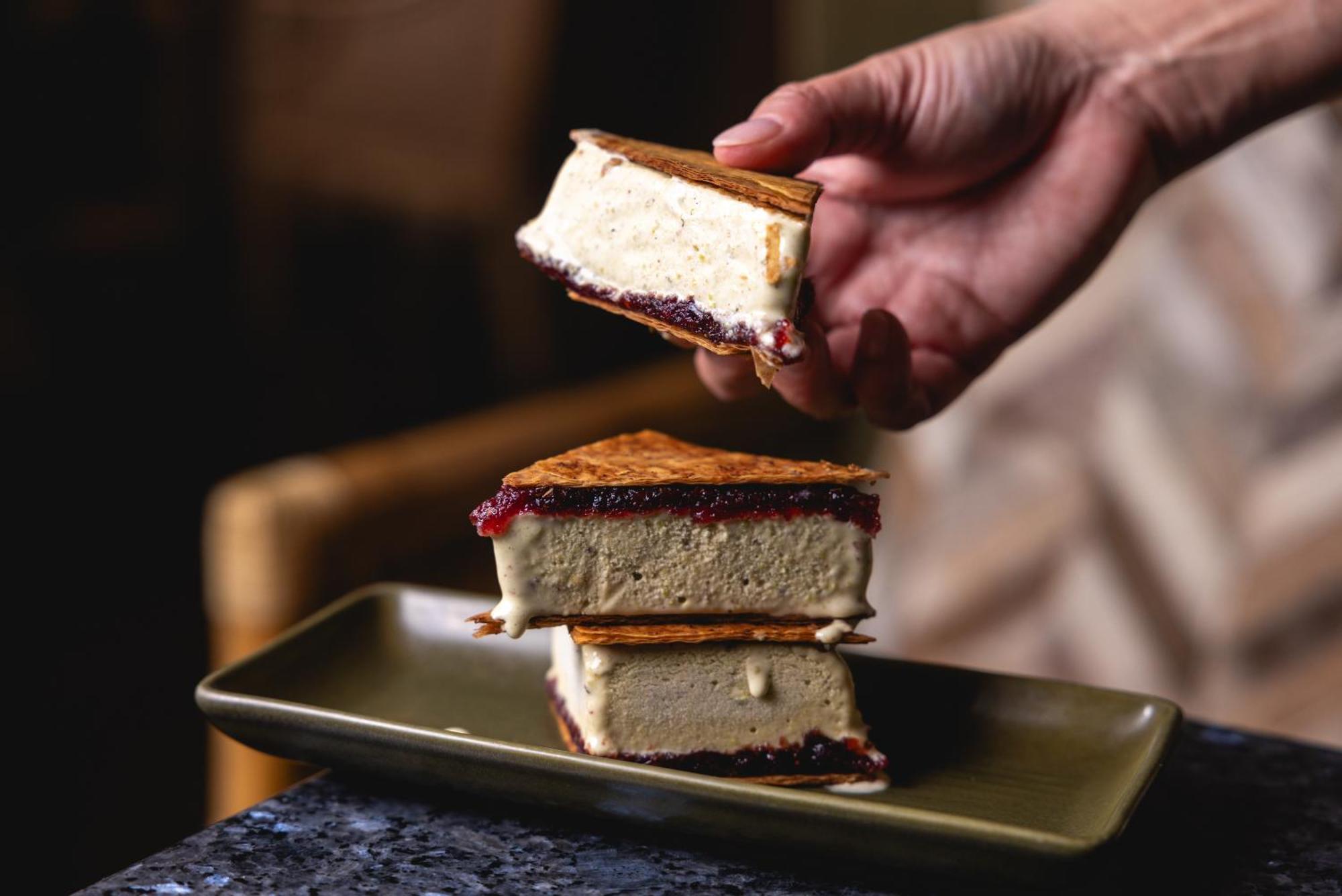 Ovolo The Valley Brisbane Exteriér fotografie A hand holding a piece of ice cream sandwich